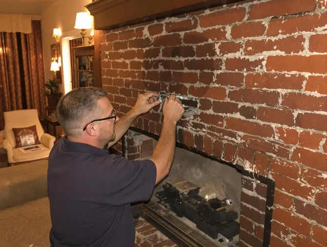 Mayfield Heights Chimney Sweep expert fixing a fireplace in Mayfield Heights, OH